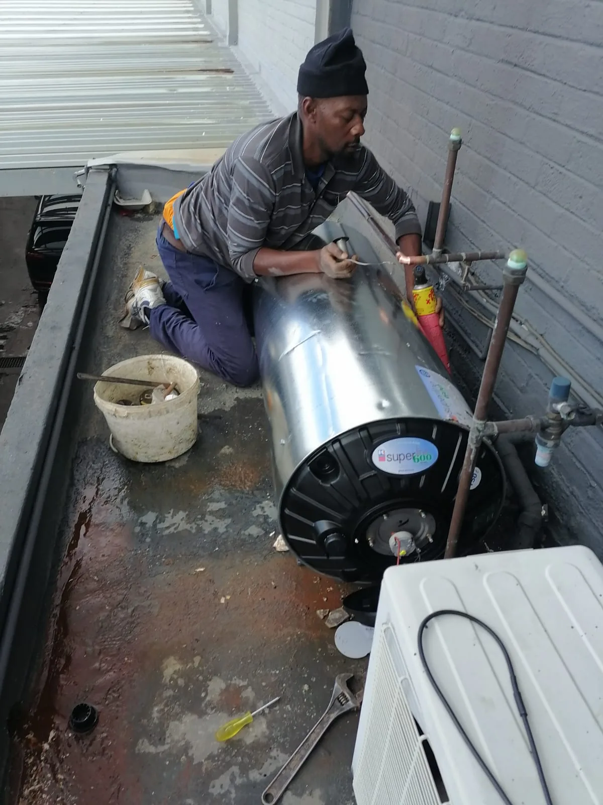 Plumb A Nator technician working on copper pipework during Blairgowrie plumbing service.