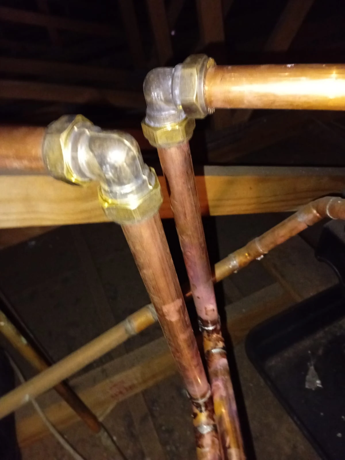 Ceiling pipe leak repair on copper pipework in a roof space.