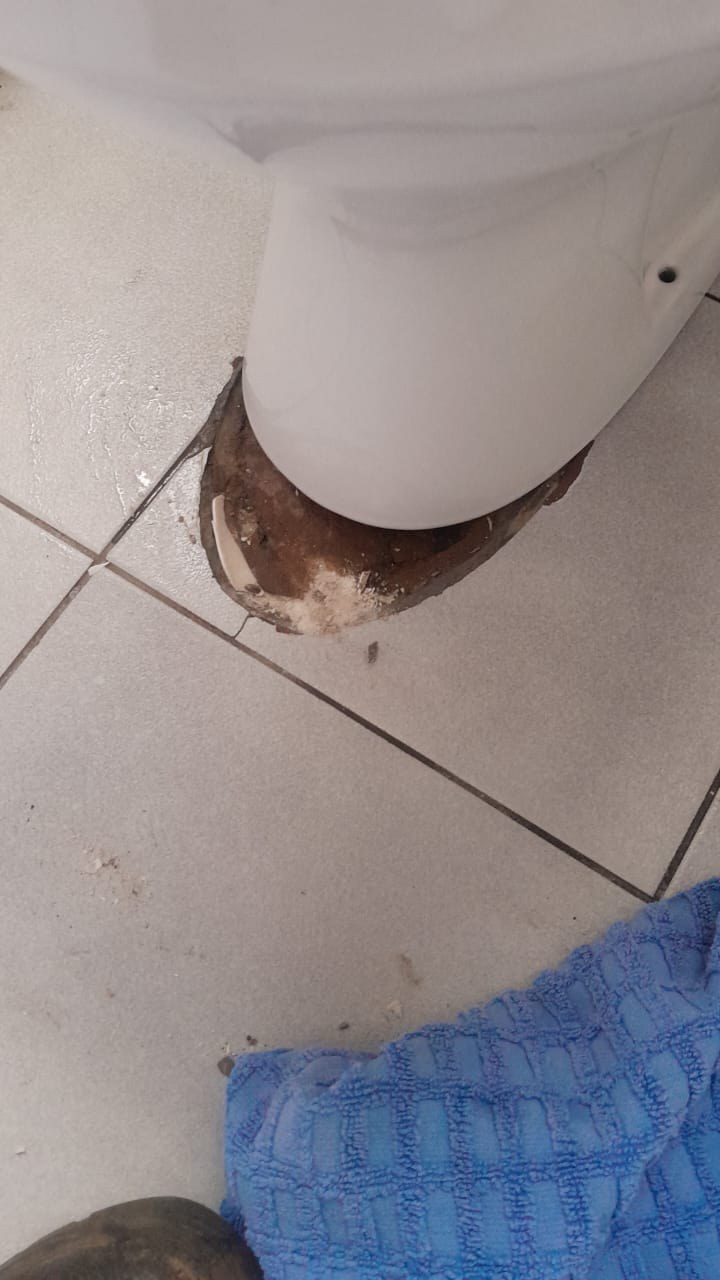 Toilet installation showing the toilet pan base area opened around the waste connection during plumbing work by Plumb A Nator.